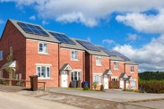 A row of three modern energy effient homes with solar panels