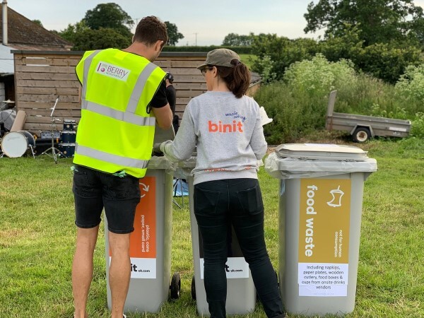 image of two people recycling