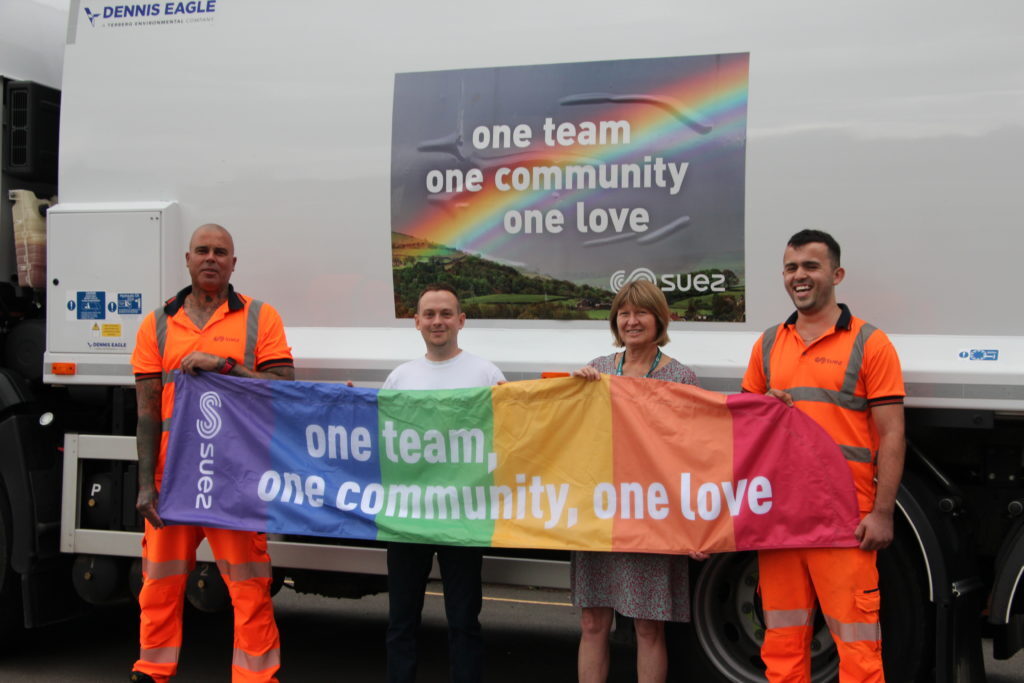 staff with the Pride rainbow flag