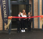 The eldest and youngest pupils of Holyrood Academy cut the ribbon to mark the opening of the new Bennett Building