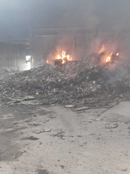 Smoke and materials alight inside the Materials Recovery Facility at Taunton Recycling Centre