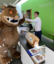 Visitor Services Assistant, Adrian Hamilton welcomes The Gruffalo to The Museum of Somerset