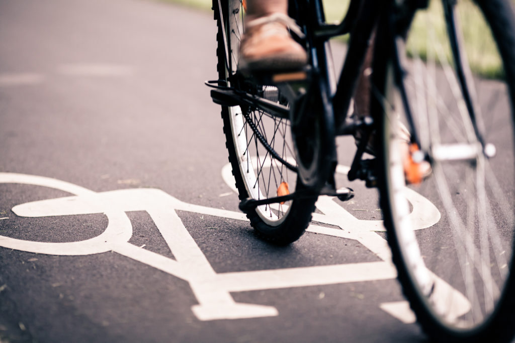 City bicycle riding on bike path