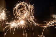 Sparklers leaving light trails in the sky