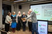 Representatives the local Pantries and Somerset Council accepting their certificate at FareShare South West's Social Impact Awards.