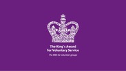 King's Award for Voluntary Service logo featuring a crown, captioned 'the MBE for Volunteer Groups'.