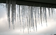 Photo showing icicles handing from a roof