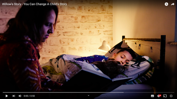 YouTube Video Thumbnail depicting a foster carer reading a bedtime story to a young boy cuddling Willow the bear.