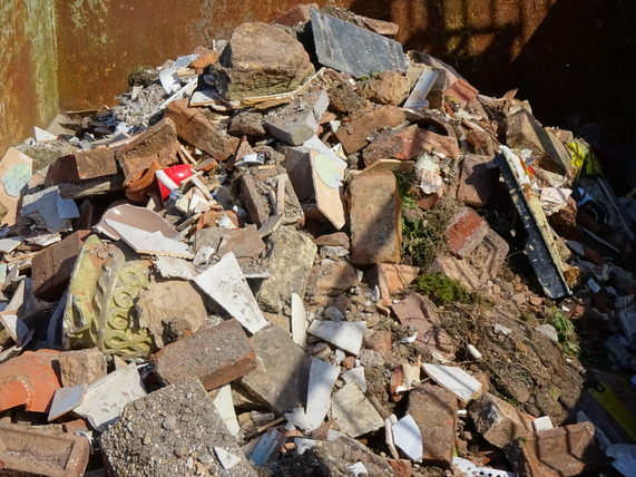 Bricks in a skip at the recycling site