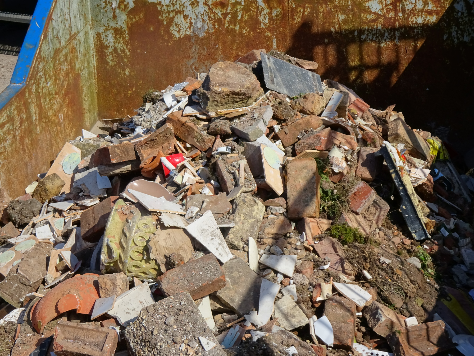 Bricks in a skip at the recycling site