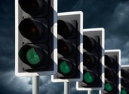 Stock image of a row of traffic lights.