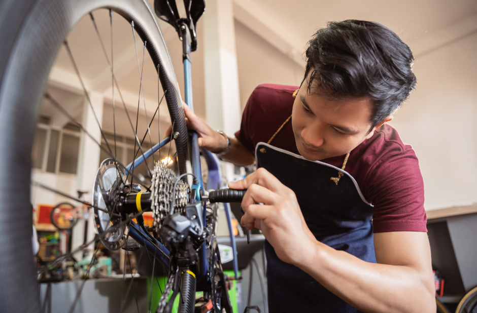 A person repairing a bicycle