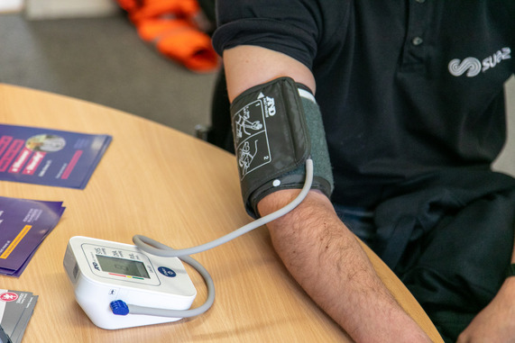 A SUEZ Waste worker having his blood pressure taken.