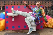 Celebrity Joe Lycett sat on a toilet promoting his programe Joe Lycett's war on sewage on channel four