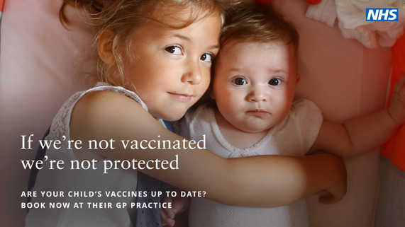 An infant girl cuddling her toddler sister, captioned: If we're not vaccinated, we're not protected'.