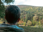 A person looking into the distance at teh Quantock hills