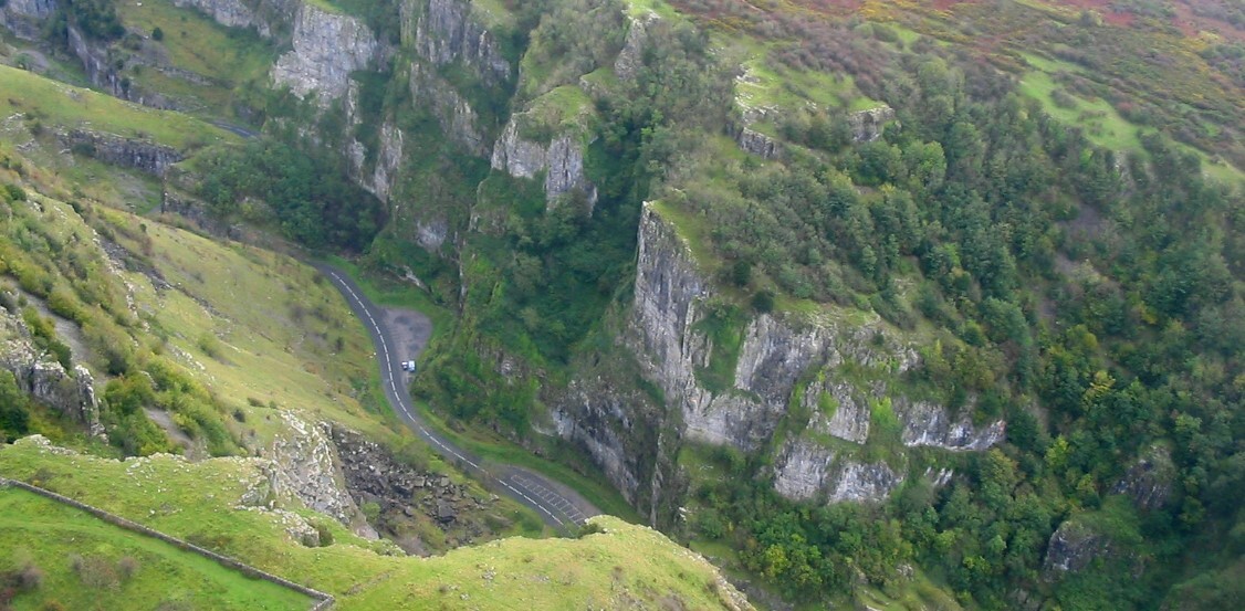 View of Cheddar Gorge from above which shows the road running through it