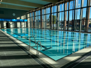 Indoor swimming pool on a sunny day.