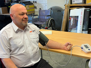 Courier Manager at Berry's Coaches, Alec Billen, having his blood pressure taken.