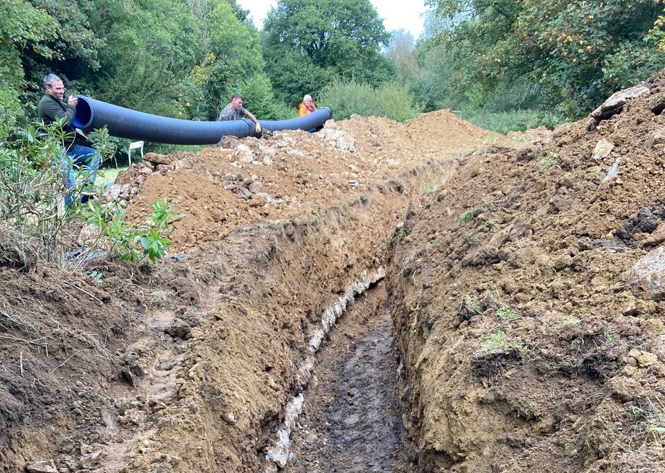 Image of the channel dug out to receive pipes to the micro hydro pump
