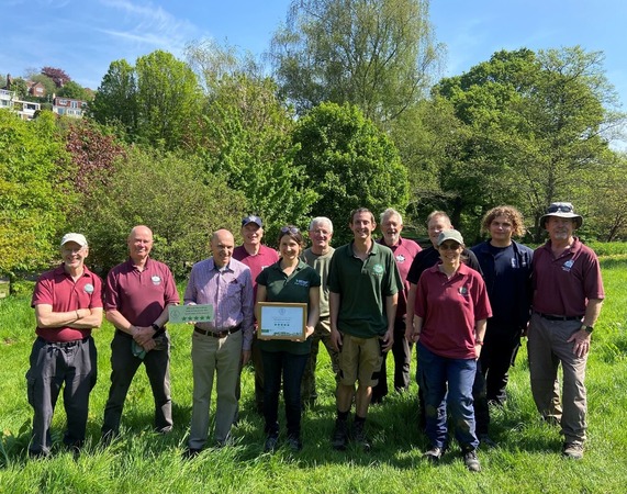 Members of the Friends of Yeovil Country Park and Council rangers who manage the park holding their award