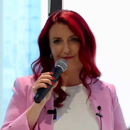 Proflie shot of MP Louise Haigh using a microphone.