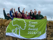 Members of the Ham Hill team punching the air in celebration of winning a green flag award.