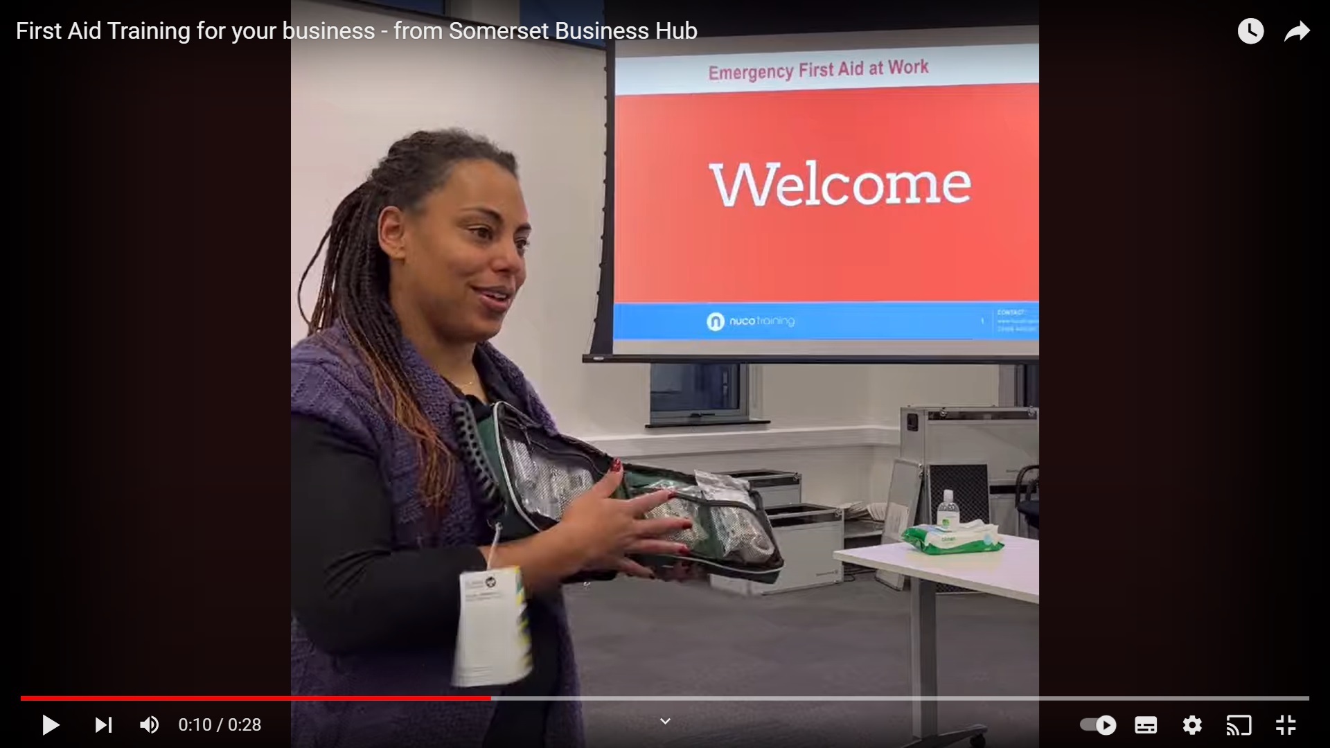 YouTube video thumbnail featuring a Somerset Business Hub staff member providing First Aid Training to businesses.