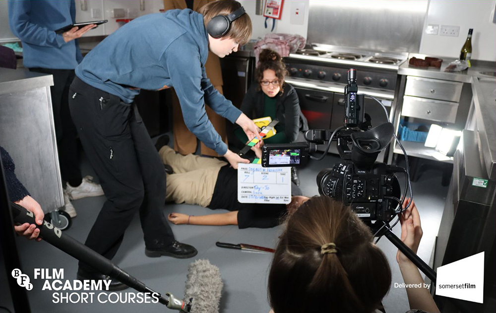 Young students directing a film set with actors, captioned: 'BFI Film Academy short courses'.