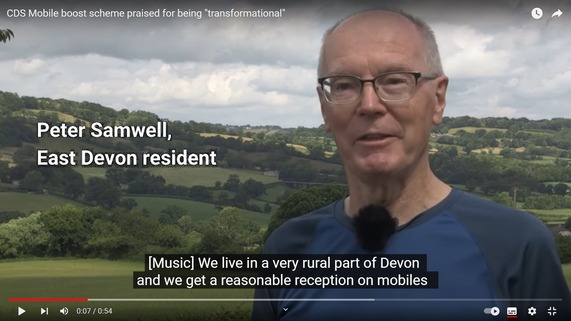 YouTube thumbnail featuring applicant, Peter Samwell, talking about the Mobile Boost scheme’s benefits with the Blackdown Hills in the background.