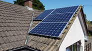 solar panels on the roof of  home generating renewable energy