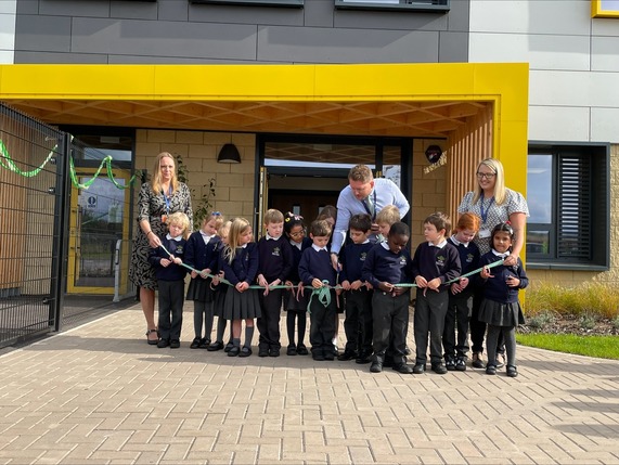 A group of people at the Orchard Grove School ribbon cutting