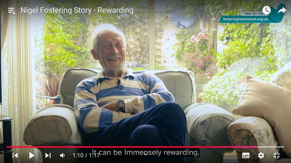 YouTube video thumbnail featuring RAF Veteran and Foster Carer, Nigel, smiling whilst sitting in his armchair.