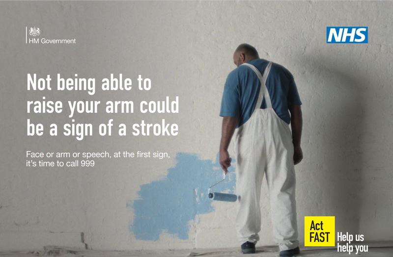 NHS graphic featuring a middle-aged painter interrupted from his work, captioned: 'Not being able to raise your arm could be a sign of a stroke'.