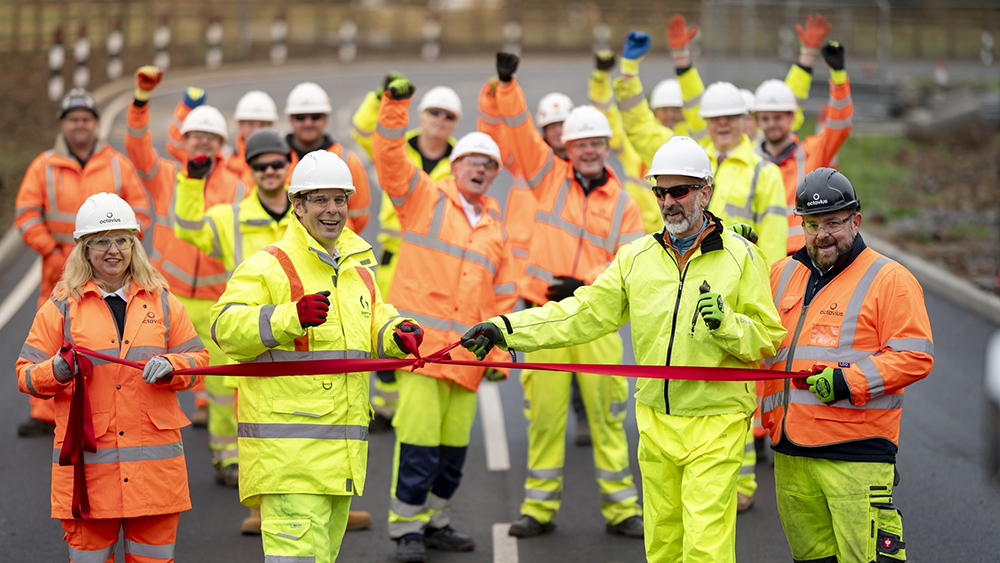 A group pf Octavius Regional Civil Engineering staff and workers celebrating and cutting a ribbon on Miner’s Arms junction.