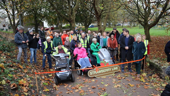 Councillors, volunteers and members of the community gathered for the ribbon cutting to open then next phase of the strawberry line project