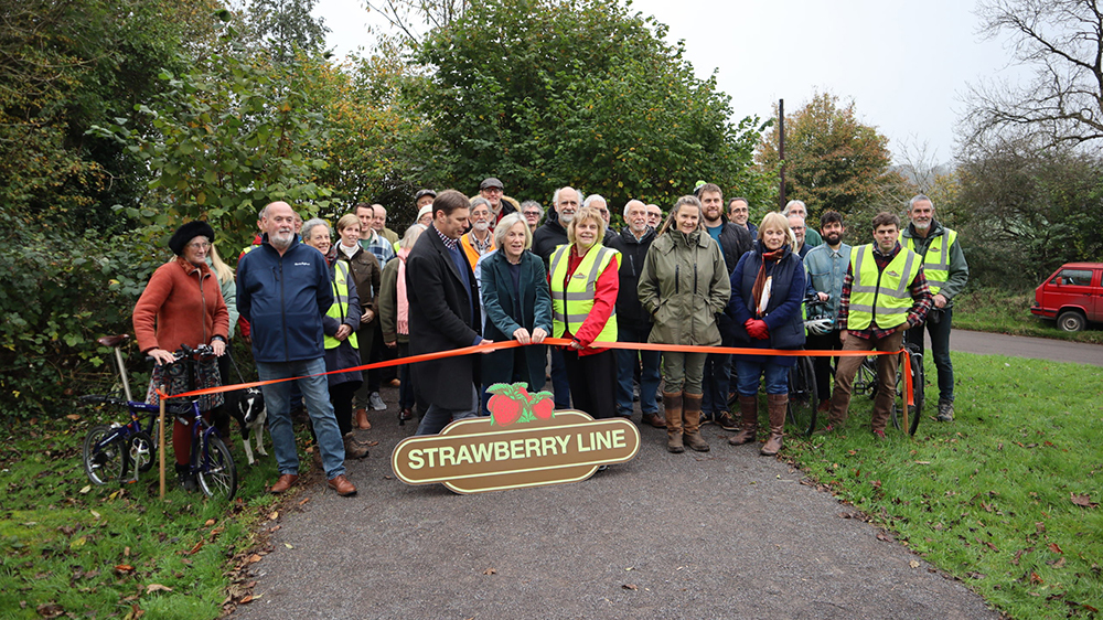 Representatives from the Council with Strawberry Line volunteers and residents at a ribbon-cutting ceremony.