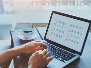 Image of a laptop with an example survey to demonstrate the survey.