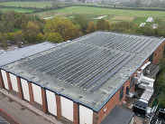 An aerial view of Wellington Sports Centre showing an array of solar panels and other decarbonisation features including air source heat pumps.