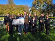 Yeovil Crematorium staff presenting a check worth £11,600 to members of Josephine’s Star.