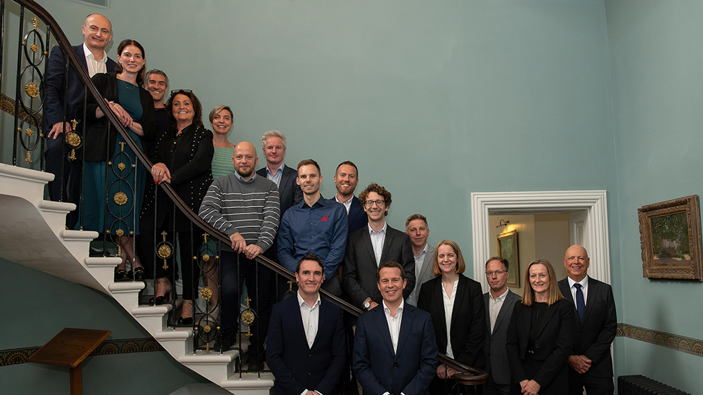 A group of judges and sponsors for the Somerset Business Awards posing on a staircase.