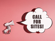Pop art graphic of a hand holding a megaphone with a speech bubble captioned: 'Call for sites!'