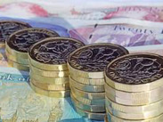 £1 coins and notes.