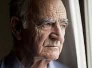 Portrait of elderly man lost in thought.
