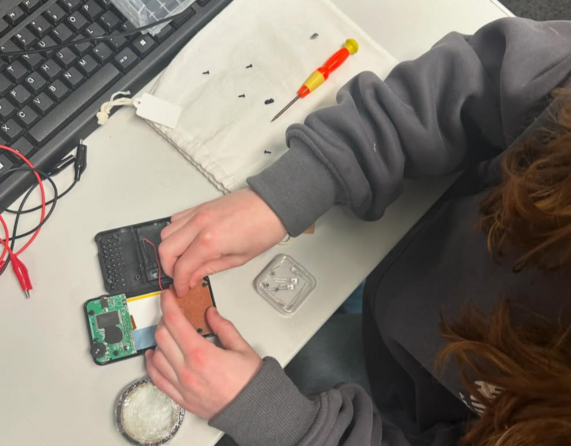 School children learn repair skills