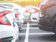 Cars parked in parking bays in a car park.