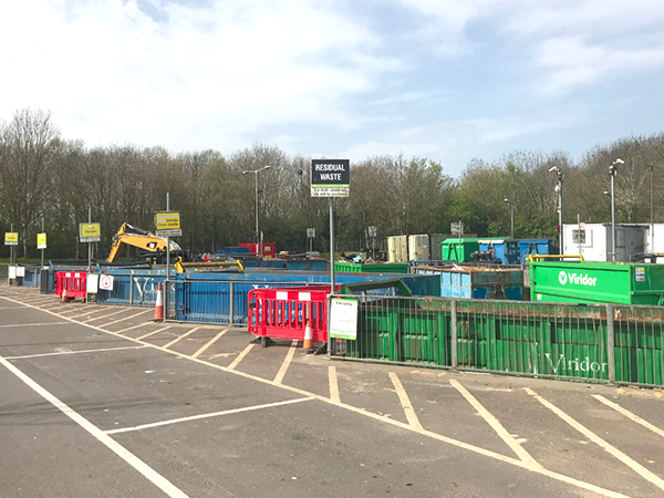 Landscape of Yeovil Recycling Site, featuring parking bays and sorting containers.