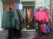 A selection of winter coats for adults and children on display in a Somerset library.