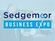 Delegates talking at a business Expo, captioned: 'Sedgemoor Business Expo'.