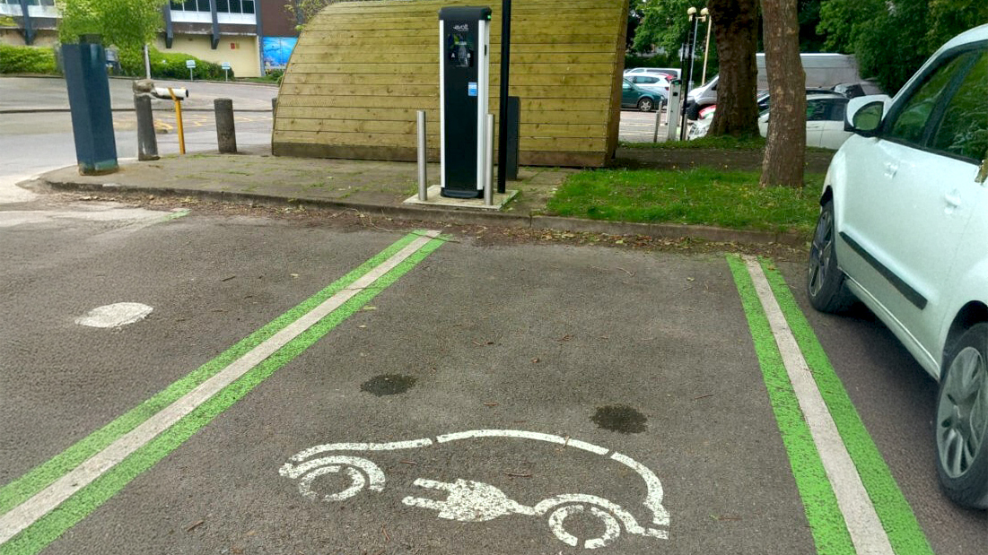 An electric vehicle charging point and parking bay at Deane House, Taunton.